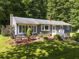 Set beneath a beautiful weeping cherry tree on a quiet Vernon cul-de-sac, 18 Fox Hollow Court offers charming curb appeal and easy ranch-style living. Its soft blue exterior and tree-lined backyard create a peaceful, private setting.
