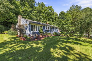 Set beneath a beautiful weeping cherry tree on a quiet Vernon cul-de-sac, 18 Fox Hollow Court offers charming curb appeal and easy ranch-style living. Its soft blue exterior and tree-lined backyard create a peaceful, private setting.