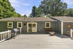 Sliding doors open to an impressive 25-by-25-foot deck. Step down to a patio. Surrounded by mature trees, the backyard offers privacy for outdoor dining, entertaining or simply relaxing.