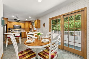 The large eat-in kitchen provides plenty of room to cook and gather, with a center island and sliding doors opening to an impressive 25-by-25-foot deck.