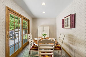 The large eat-in kitchen provides plenty of room to cook and gather, with a center island and sliding doors opening to an impressive 25-by-25-foot deck.