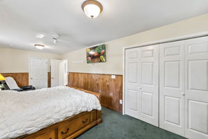Currently being used as the primary with two sets of closets! Hardwood floors are believed to be beneath the bedroom carpeting, offering additional potential. Previously this was 2 bedrooms, can be converted back.