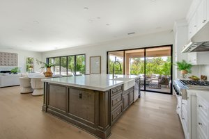 Walls of glass open to private backyard