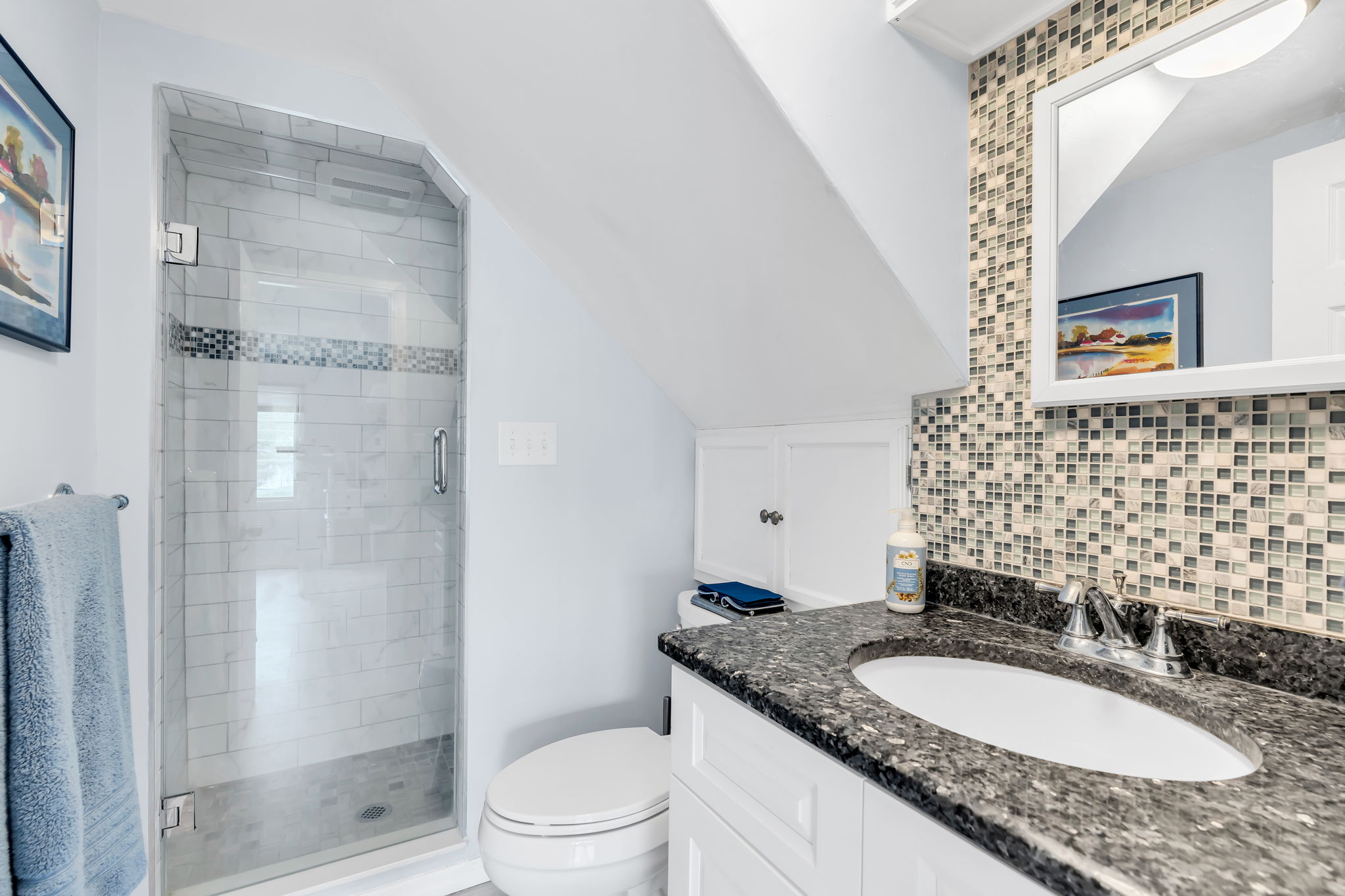 Primary new full bath, walk-in glass shower door with tile surround