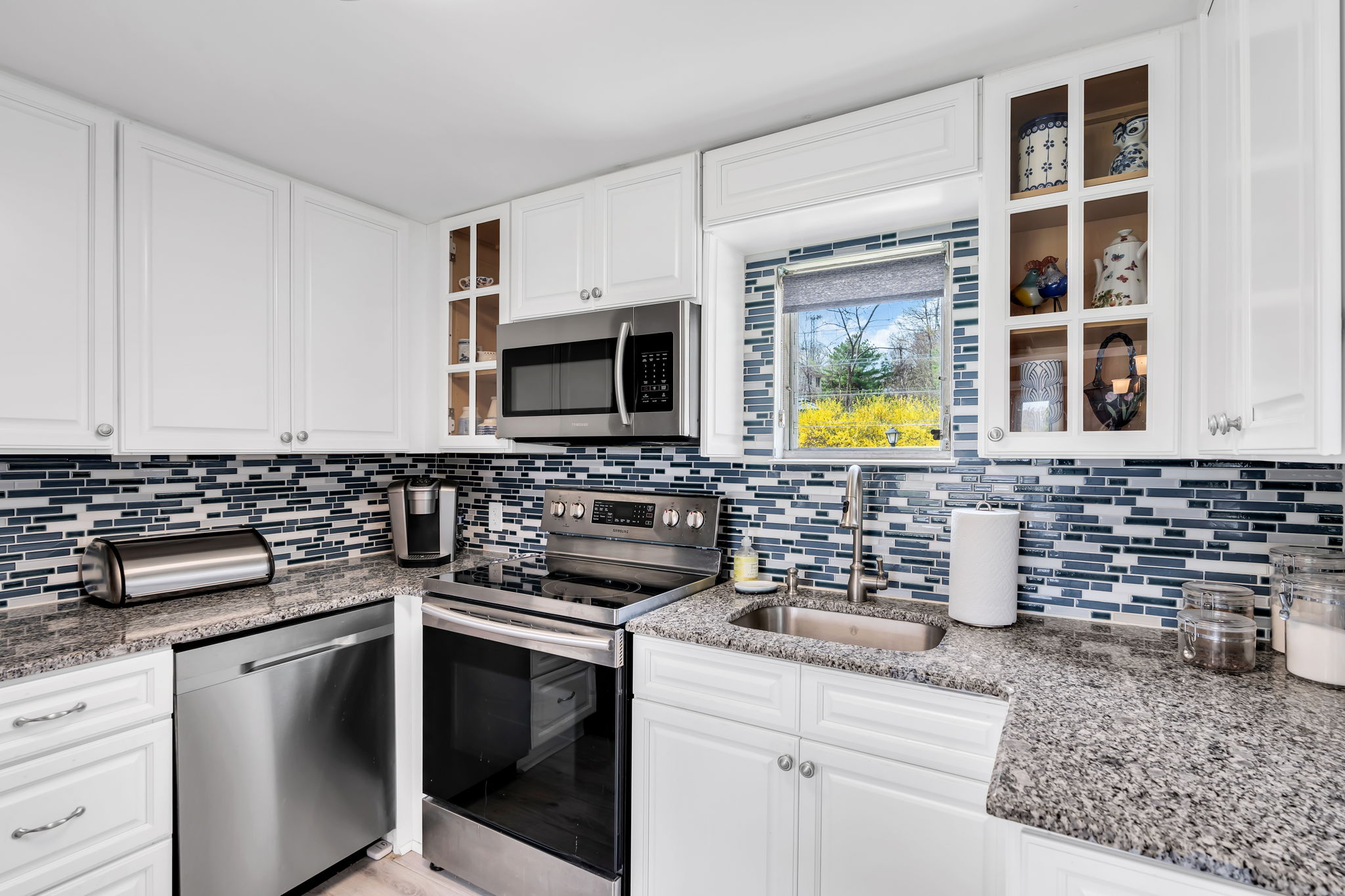 New white cabinetry, stainless appliances