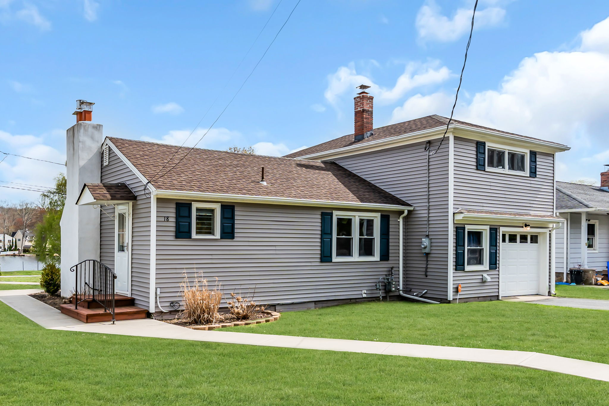 Side door to kitchen entry. One car garage with inside entrance
