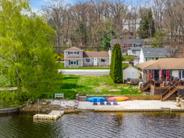 View of sandy beach and lot to house