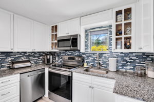 New white cabinetry, stainless appliances