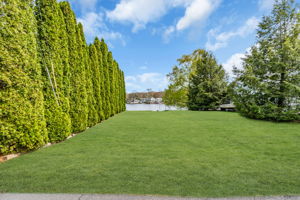 Manicured level lakefront lot