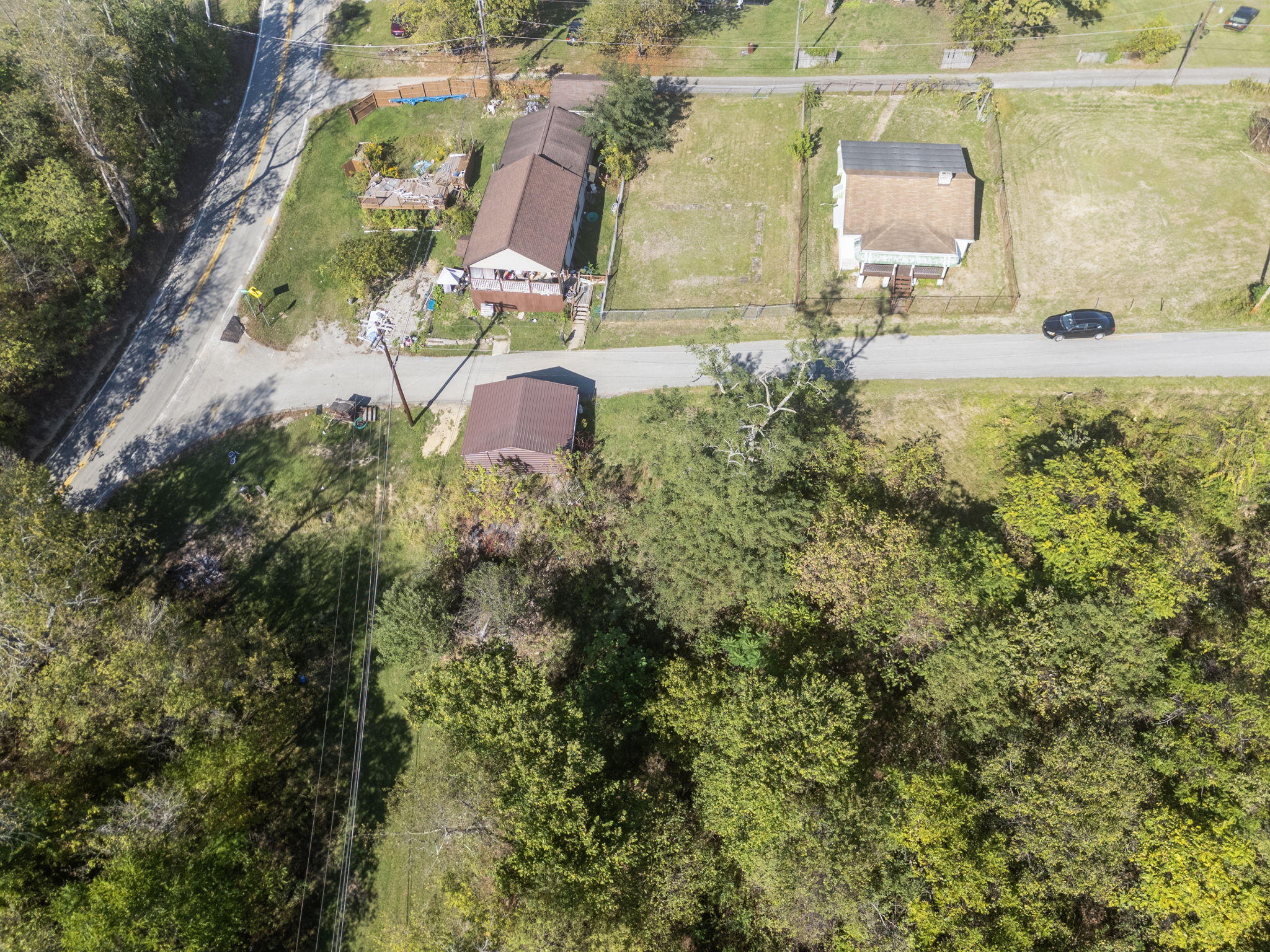 LOT 1 (inside fence) AND 2 - (wooded land only)