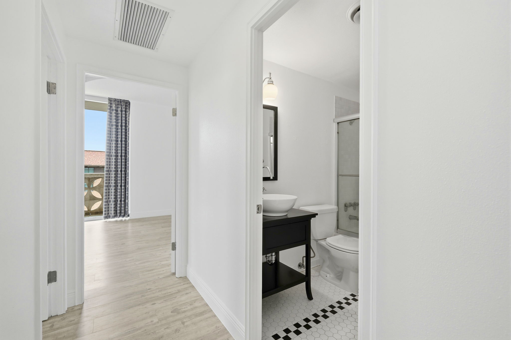 Hallway to Guest Bath and Primary Bedroom