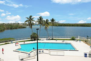 Resort style pool overlooks the water