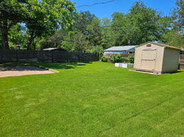 Large Fenced backyard with a patio area and a Tuff Shed (8x12). Plenty of room to relax or play with your dog(s).