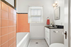 First floor bath.  Updated features with classic tiles and tub