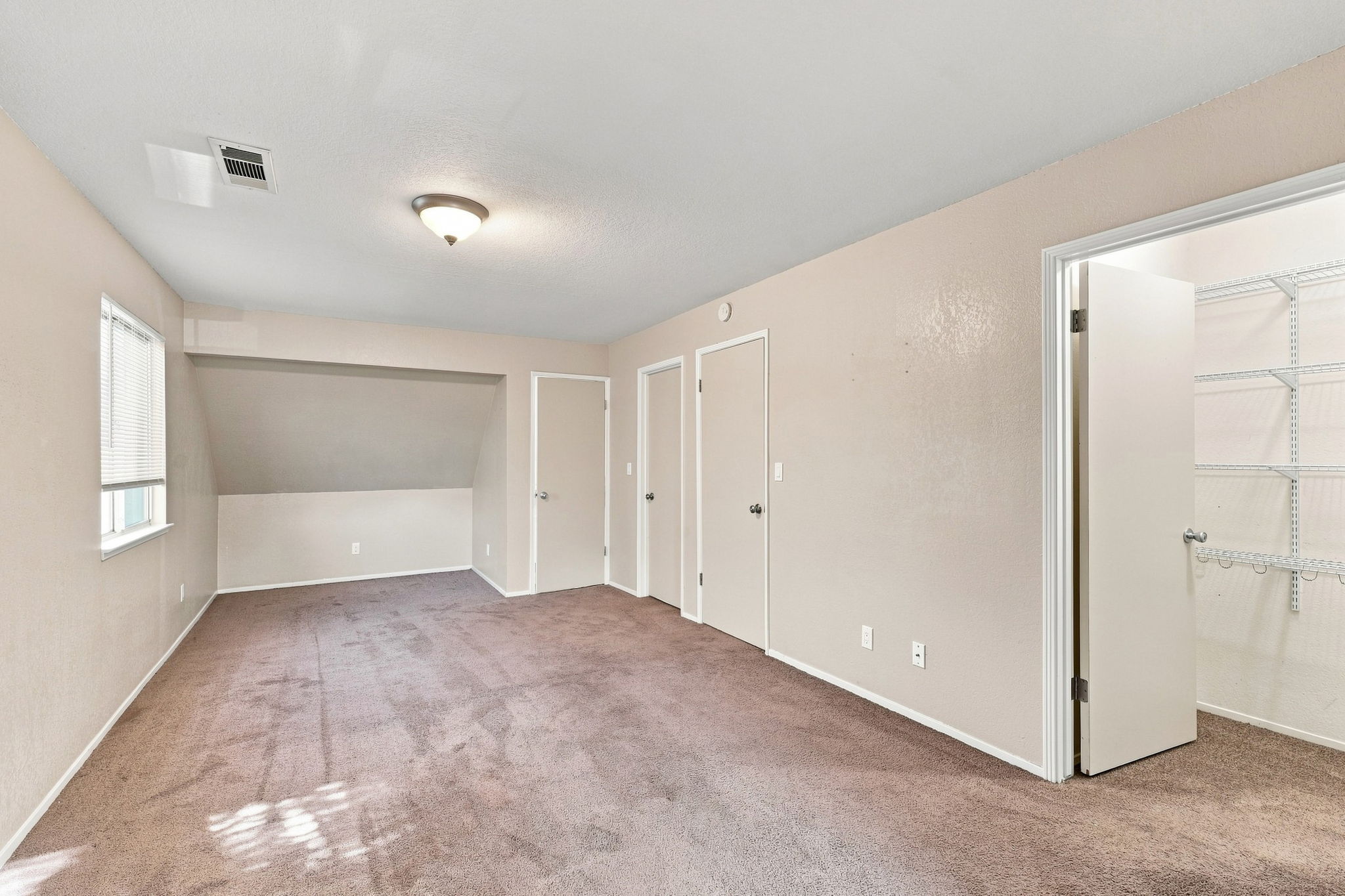 Spacious primary bedroom 2 with multiple closets