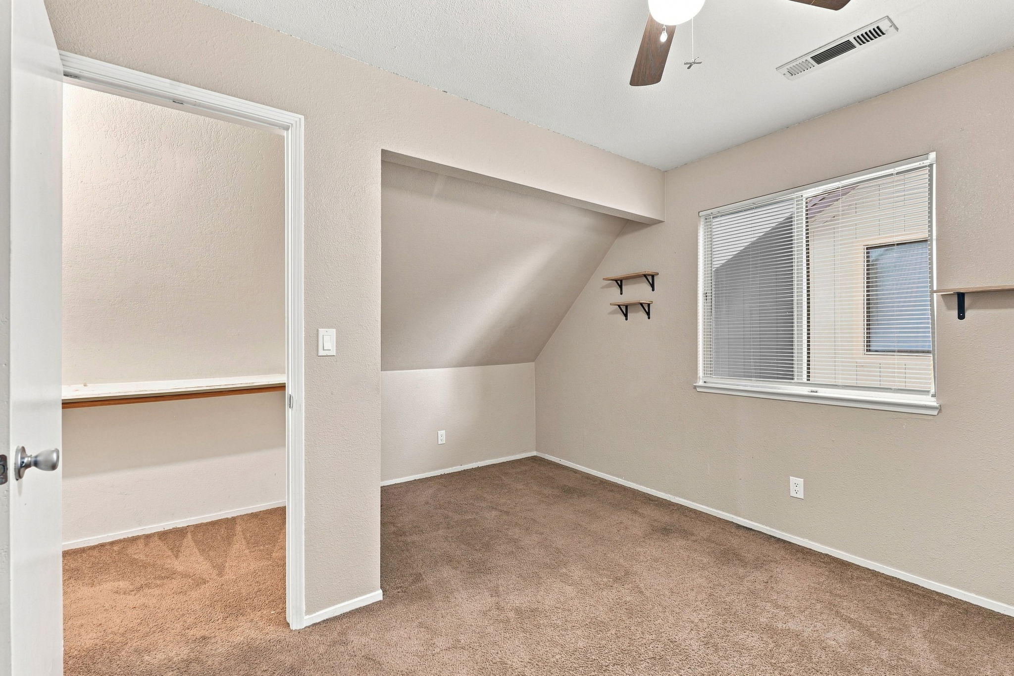 Bedroom 3 with closet alcove and ceiling fan