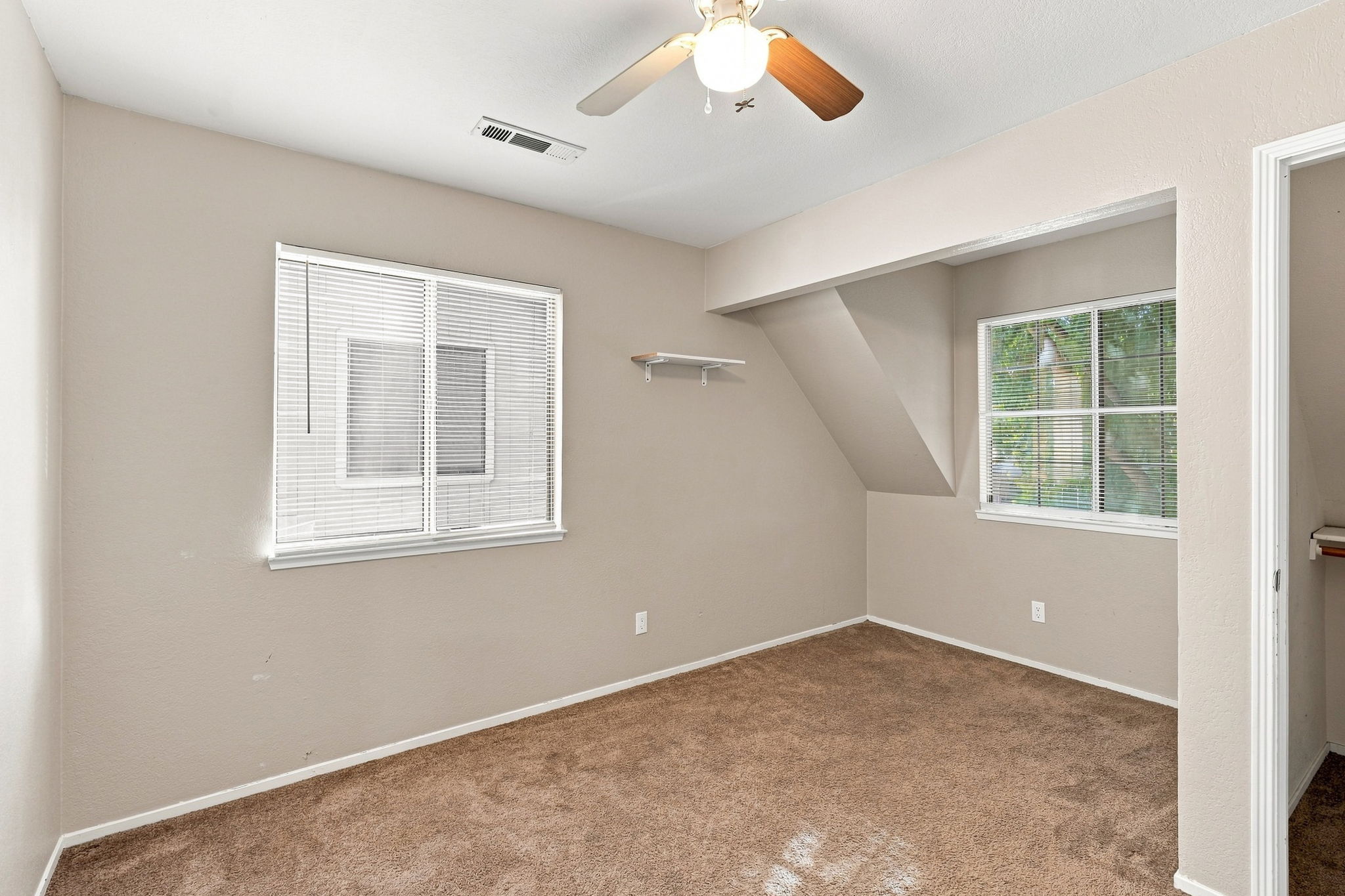 Bedroom 4 with recessed alcove and two windows