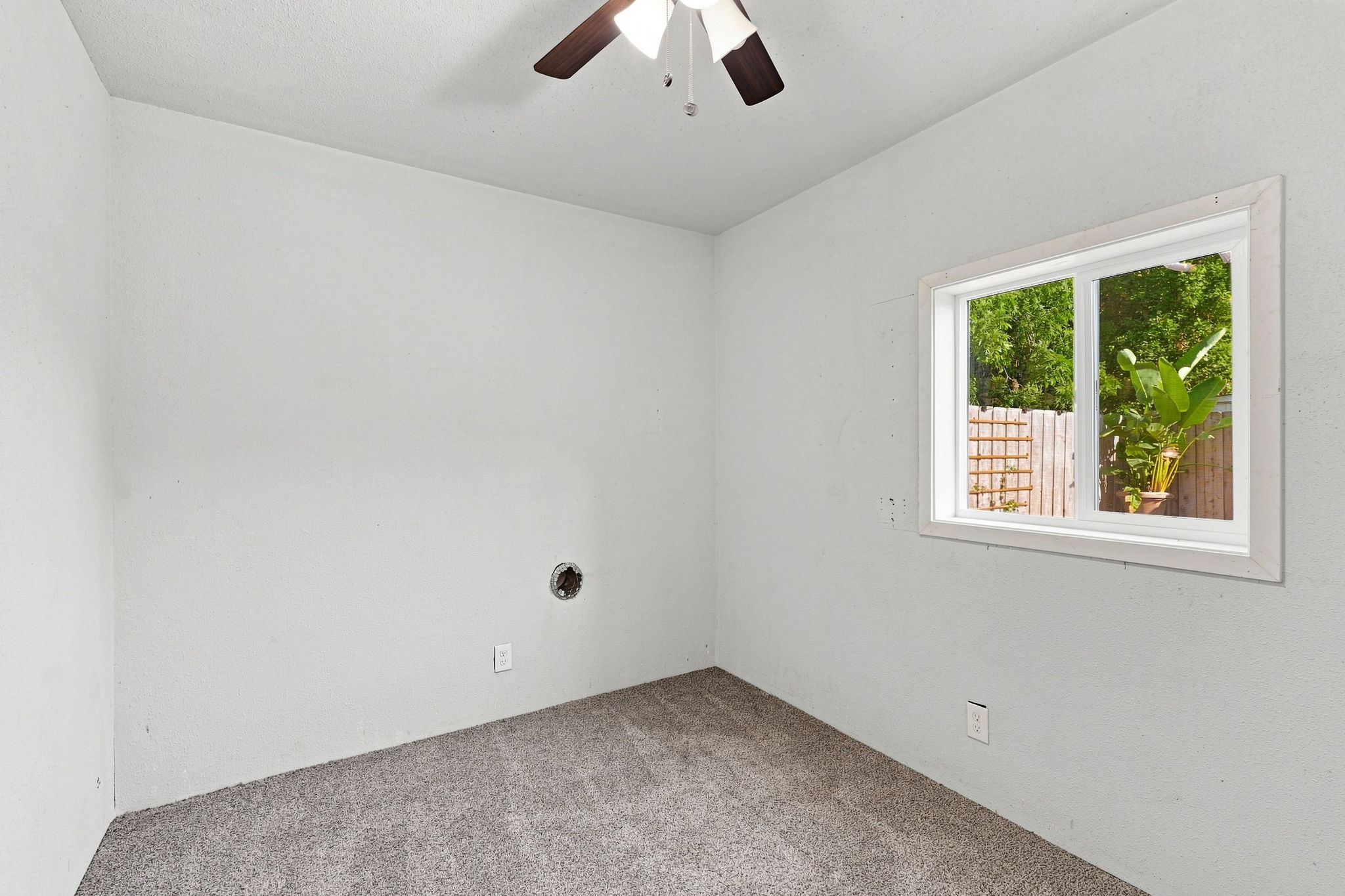 Second finished garage bonus room with backyard-facing window