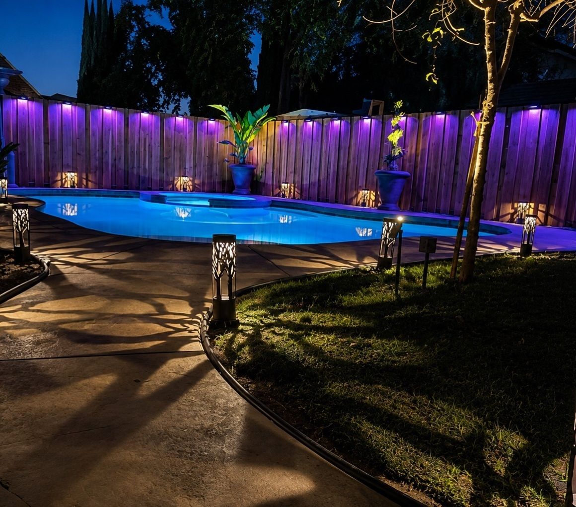 Pool and spa with app-controlled color-changing ambient lighting