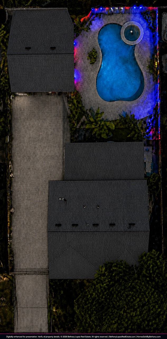 Digitally enhanced aerial view of the home, extended driveway, pool, and spa