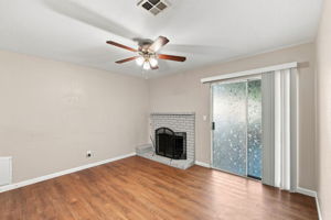 Living room with fireplace and sliding patio door