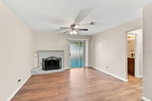 Living room with fireplace and wood-look flooring