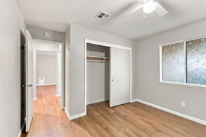 Downstairs Bedroom 1 with sliding-door closet