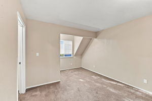 Primary bedroom 2 with sloped ceiling detail