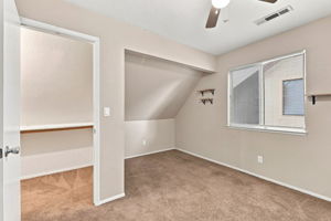 Bedroom 3 with closet alcove and ceiling fan