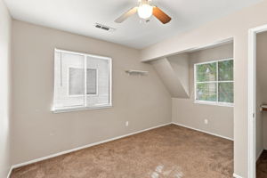 Bedroom 4 with recessed alcove and two windows