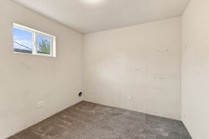 Finished garage bonus room with high window—ideal for an office or flex space