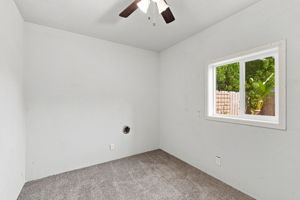 Second finished garage bonus room with backyard-facing window