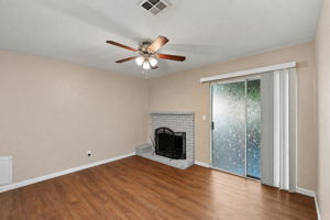 Living room with fireplace and sliding patio access