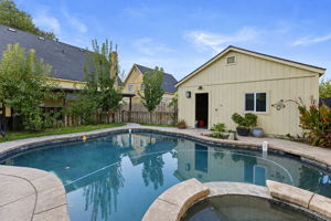 Pool and spa with garage backdrop