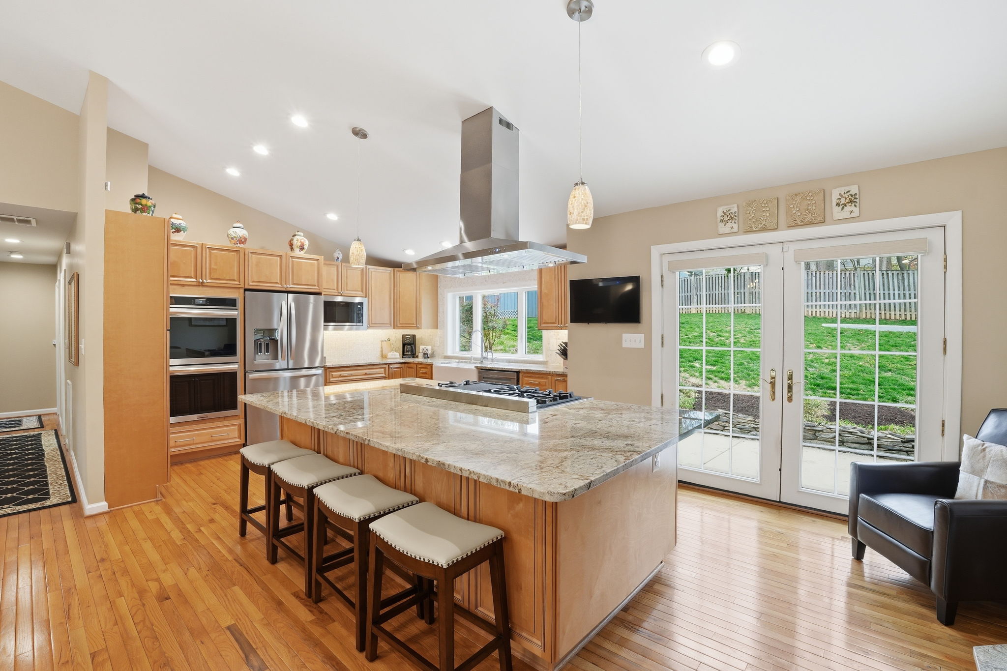 Renovated Kitchen with Center Island and access to Rear Deck