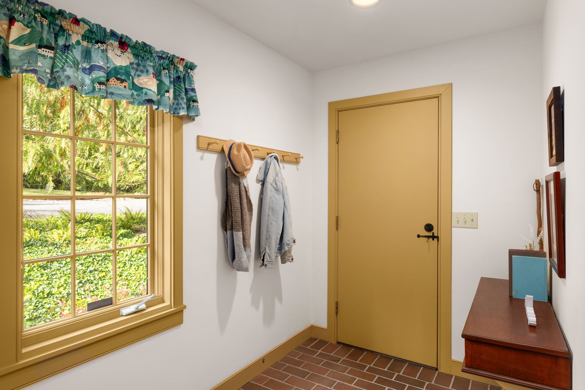 A convenient side entry gives residents a place to hang coats and leave the day behind.