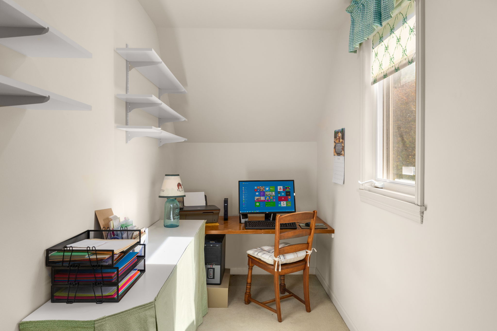 Tucked off the bedroom, a small alcove retreat offers a quiet spot for work or hobbies.