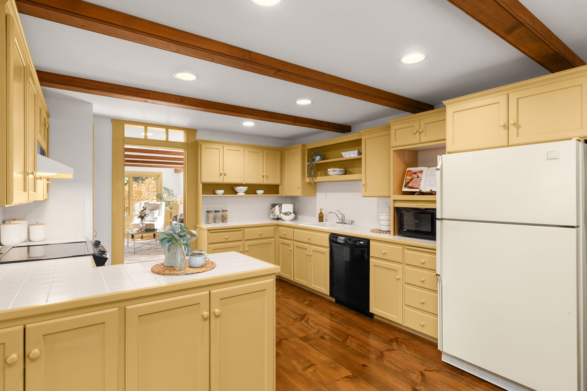 Generous cabinetry keeps kitchen essentials close at hand, with open shelves for favorite dishes and cookbooks.