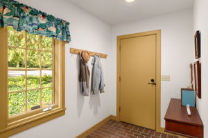 A convenient side entry gives residents a place to hang coats and leave the day behind.