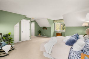 With a closet close at hand and a dedicated full bath just down the short hall, this separate wing makes a comfortable retreat.