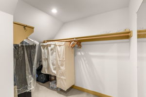 A walk-in closet is one of two closets serving the primary bedroom.