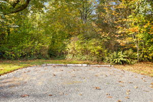 Extra guest parking tucked among the trees makes entertaining easy.