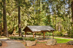 A sheltered picnic area at Flowing Lake Park offers a shady spot to gather and enjoy the outdoors.