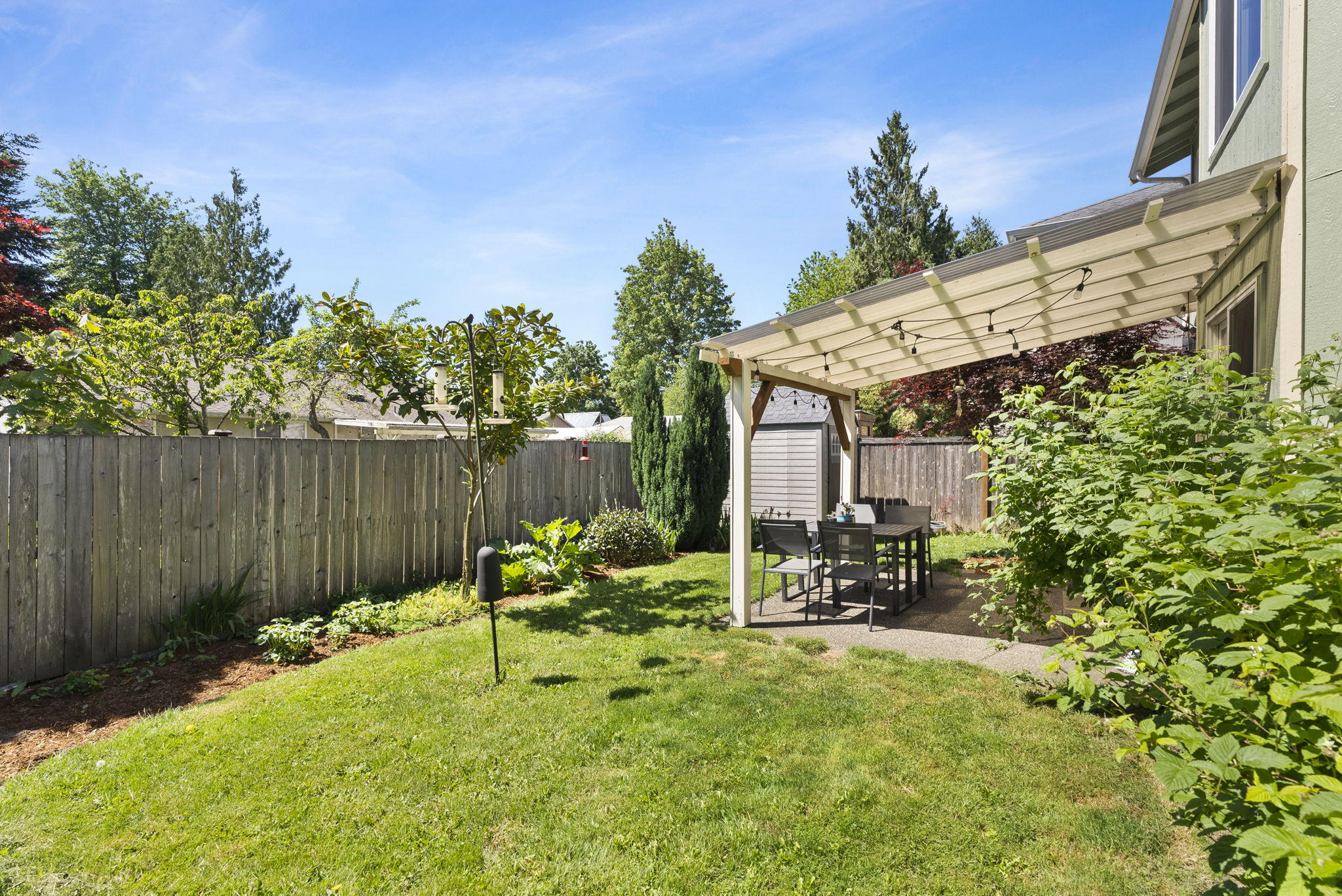 Charming backyard with a covered area perfect for hanging out