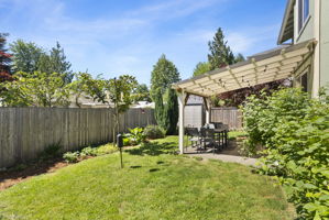Charming backyard with a covered area perfect for hanging out