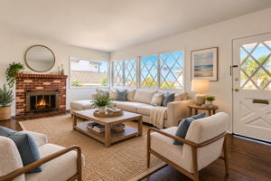 The Living Room which Overlooks the Front Yard, Is Open, Bright and Flooded with Light from the Surrounding Windows. Virtually Staged