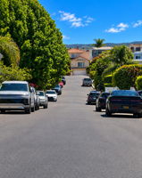 enhanced The short street has beautiful trees and nicely maintained family homes. Photo enhanced