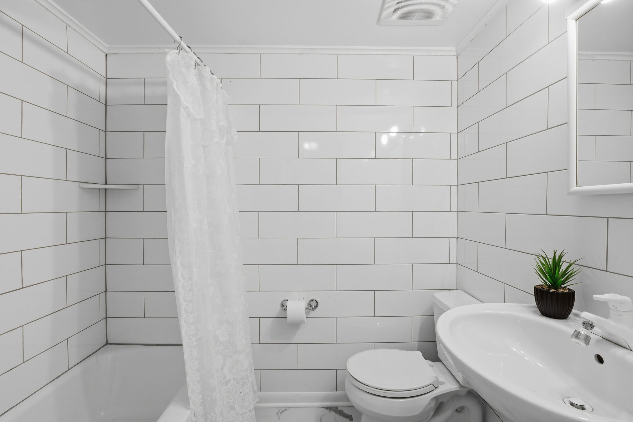 Full bath in basement level, with tub