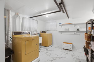 Large laundry room, utilities in separate closed room
