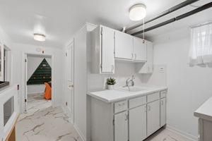 Sink, refrigerator, microwave and plenty of countertop space and cabinets